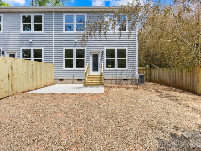 1944 Purser Drive, Charlotte, NC 28215.  MLS# CAR4378594, YatesRealty ID 24916. Spacious fenced backyard with concrete pad