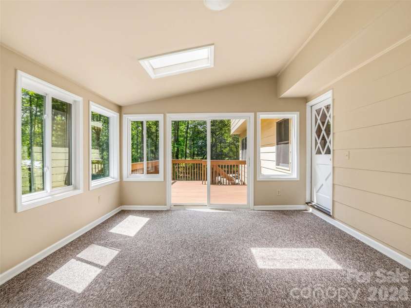 11 Woodmere Drive, Arden, NC 28704.  MLS# CAR4382384, YatesRealty ID 24926. Enjoy the natural light while also enjoying the indoors.
