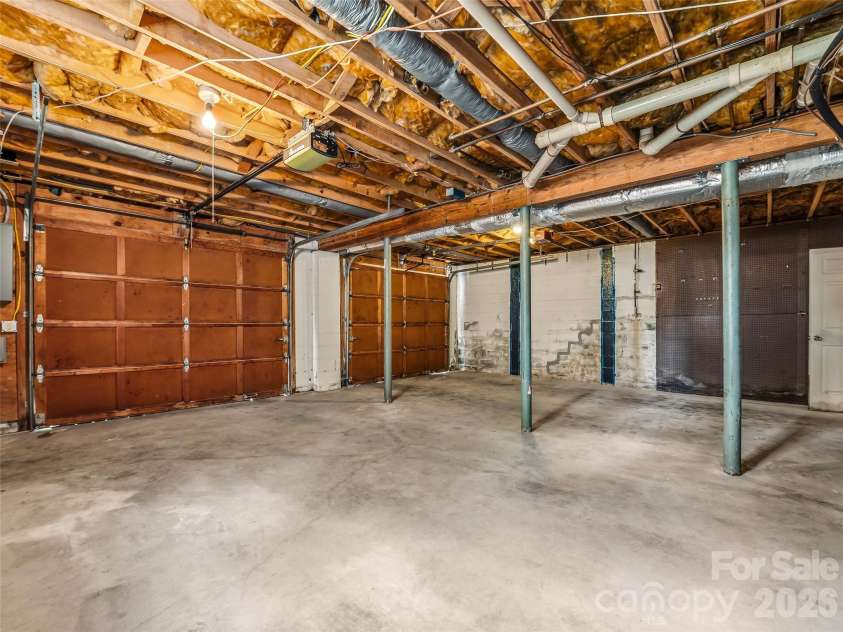 11 Woodmere Drive, Arden, NC 28704.  MLS# CAR4382384, YatesRealty ID 24926. Large two-car garage. 