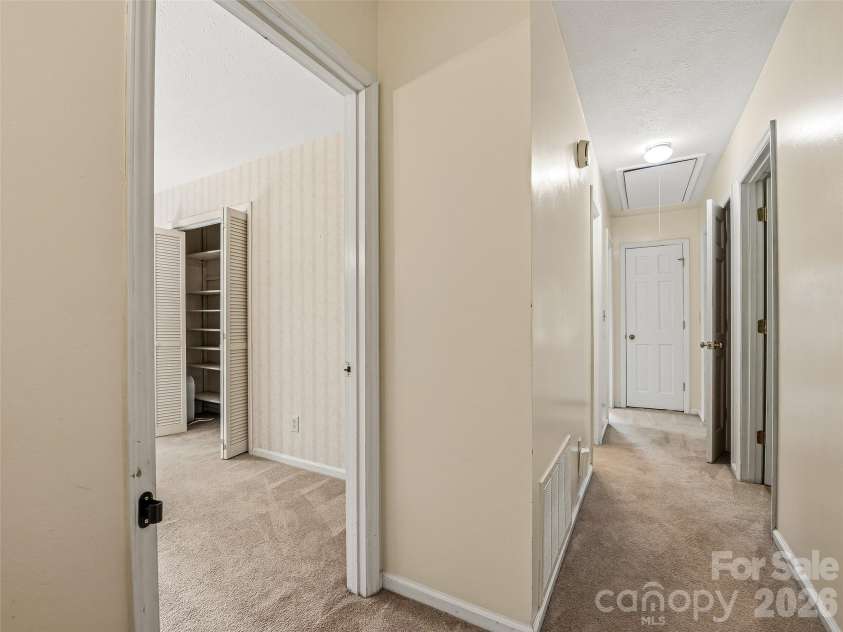 11 Woodmere Drive, Arden, NC 28704.  MLS# CAR4382384, YatesRealty ID 24926. Second floor hallway.