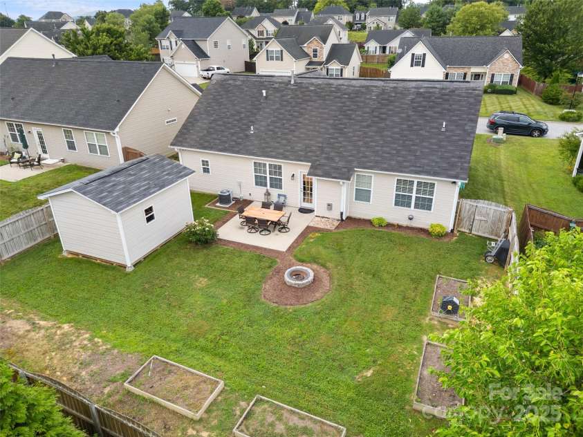 144 Haw River Road, Fletcher, NC 28732.  MLS# CAR4279865, YatesRealty ID 24943. Drone of back yard