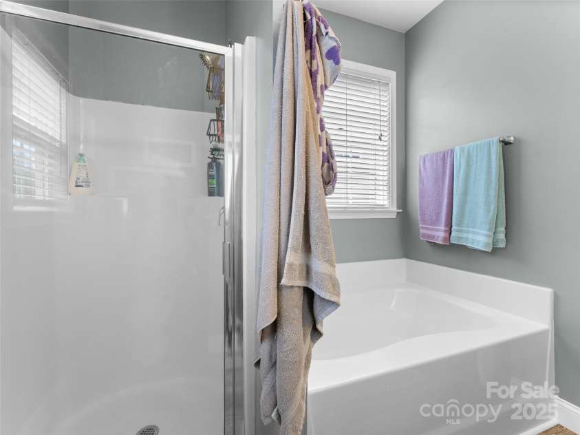 144 Haw River Road, Fletcher, NC 28732.  MLS# CAR4279865, YatesRealty ID 24943. Free standing shower and garden tub