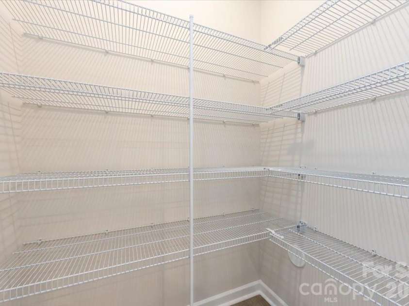 6017 Longar Lane, Charlotte, NC 28269.  MLS# CAR4356792, YatesRealty ID 24944. Large kitchen pantry