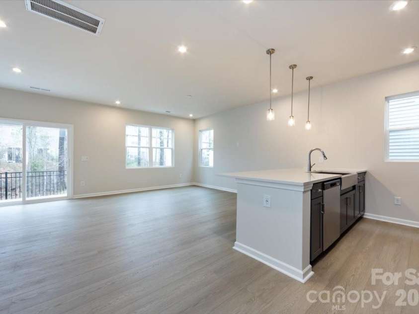 6017 Longar Lane, Charlotte, NC 28269.  MLS# CAR4356792, YatesRealty ID 24944. Light filled first floor with added end-unit windows