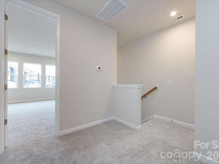 6017 Longar Lane, Charlotte, NC 28269.  MLS# CAR4356792, YatesRealty ID 24944. Second floor landing