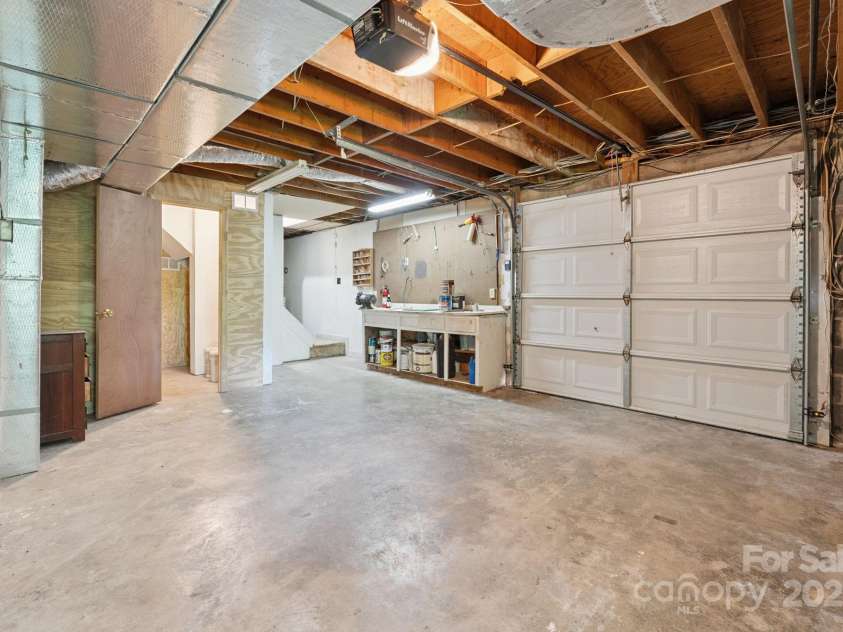 44 Rainbow Road, Highlands, NC 28741.  MLS# CAR4279105, YatesRealty ID 24947. Workshop in Basement Garage