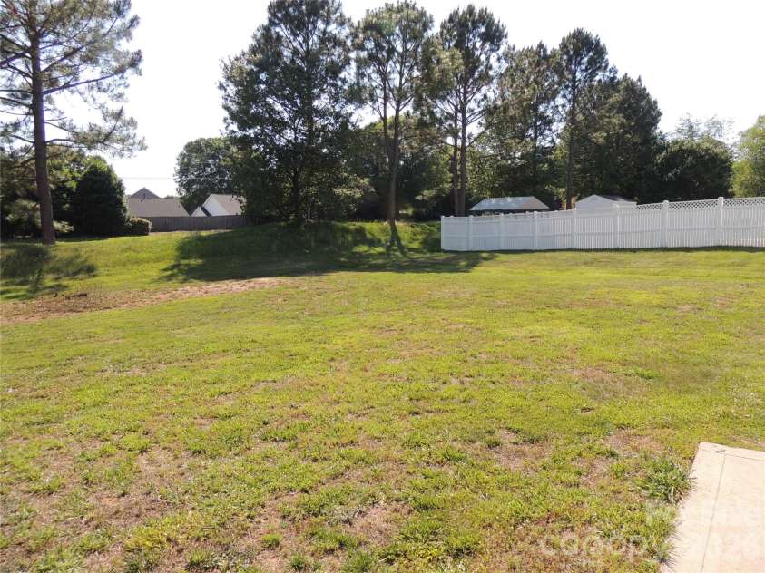 113 Ashton Woods Court, Mount Holly, NC 28120.  MLS# CAR4383374, YatesRealty ID 24973. Back Yard