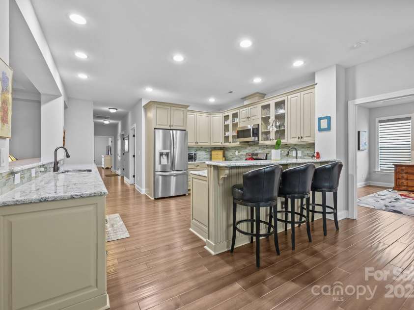11621 Mount Argus Drive, Cornelius, NC 28031.  MLS# CAR4251718, YatesRealty ID 24977. Fantastic kitchen layout with plenty of prep space and two raised bar areas