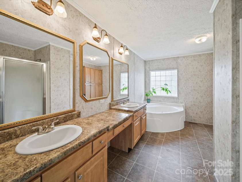 714 Helms Efird Road, Marshville, NC 28103.  MLS# CAR4263348, YatesRealty ID 24982. Owner's Bathroom