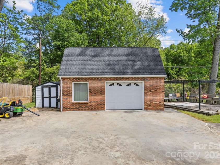 6035 Idlebrook Drive, Charlotte, NC 28212.  MLS# CAR4247653, YatesRealty ID 24986. Seller would consider sale to include zero turn mower, weed eater and blower. A separate shed for additional storage in this fully fenced backyard.