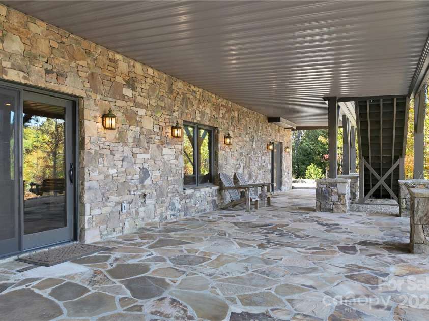 1291 Indian Camp Mountain Road, Rosman, NC 28772.  MLS# CAR4282700, YatesRealty ID 2499. Downstairs patio