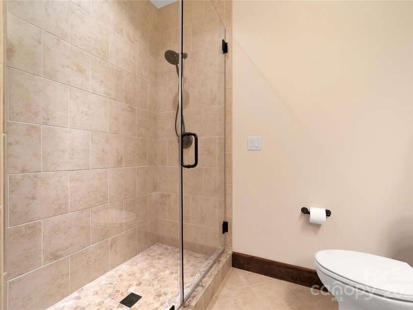 1291 Indian Camp Mountain Road, Rosman, NC 28772.  MLS# CAR4282700, YatesRealty ID 2499. Lower level bath