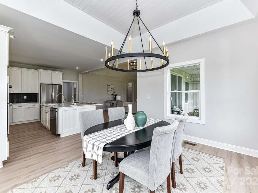 181 Lone Pine Road, Statesville, NC 28625.  MLS# CAR4265324, YatesRealty ID 24990. Beautiful Dining Area with tray, ship lap ceiling, custom light fixture & large windows for great natural light!