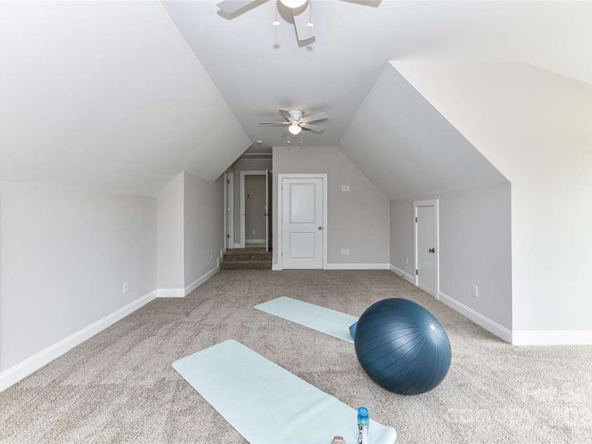 181 Lone Pine Road, Statesville, NC 28625.  MLS# CAR4265324, YatesRealty ID 24990. Large Bonus Room with attic storage & dual ceiling fans!