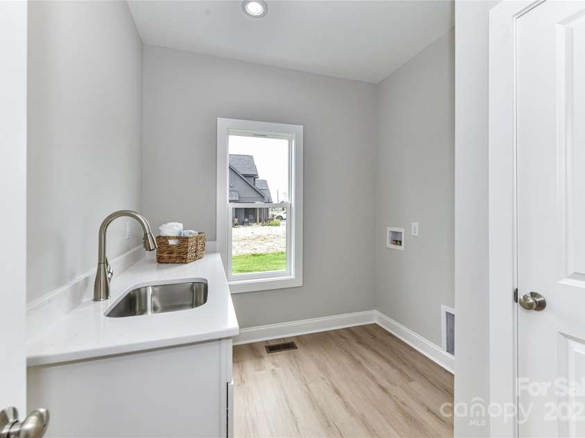 181 Lone Pine Road, Statesville, NC 28625.  MLS# CAR4265324, YatesRealty ID 24990. Large Laundry Room with sink on main level!