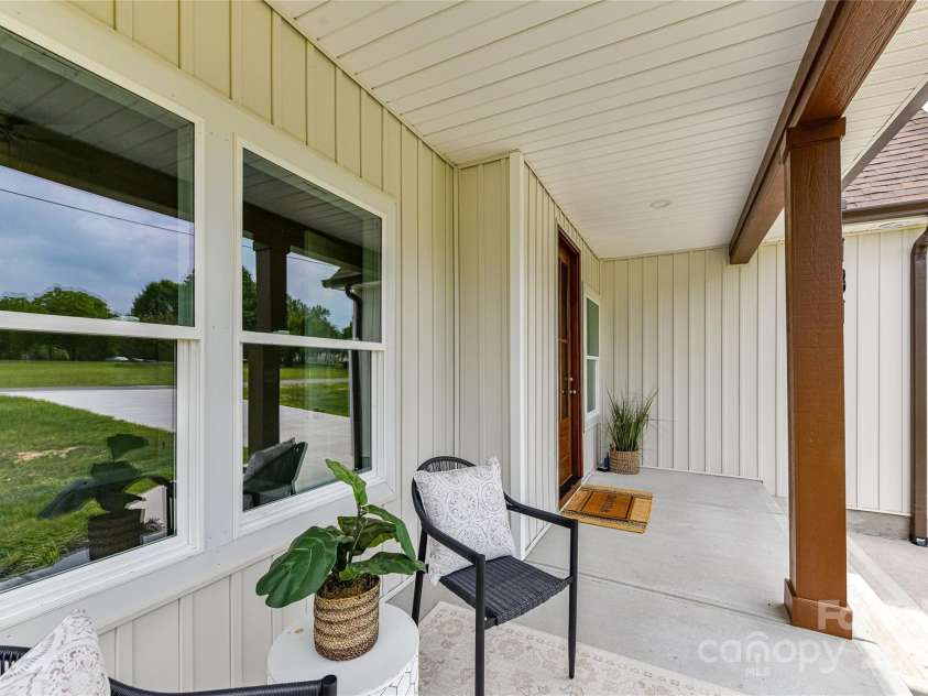 181 Lone Pine Road, Statesville, NC 28625.  MLS# CAR4265324, YatesRealty ID 24990. Plenty of room to relax on this expansive front porch!