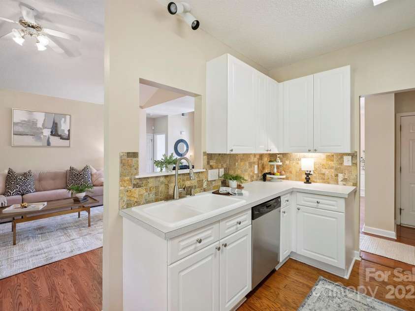 136 Samdusky Lane, Mooresville, NC 28117.  MLS# CAR4275887, YatesRealty ID 25005. Charming Cut out from Kitchen into Great Room view!