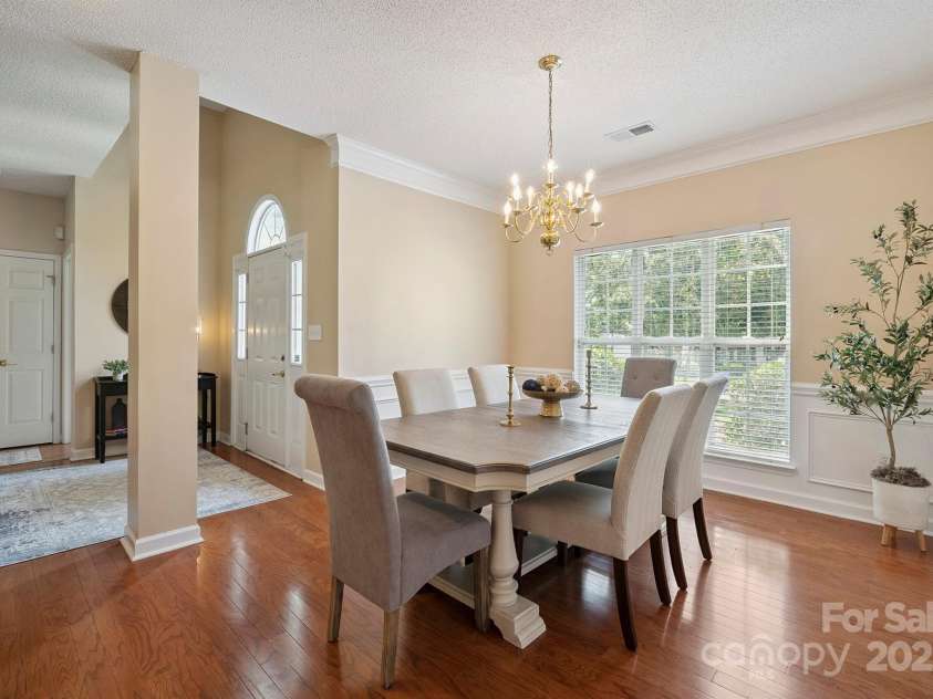136 Samdusky Lane, Mooresville, NC 28117.  MLS# CAR4275887, YatesRealty ID 25005. Formal Dining with crown molding, wainscoting & great natural light flowing in!