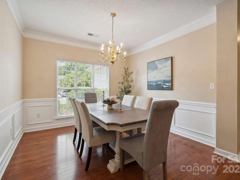 136 Samdusky Lane, Mooresville, NC 28117.  MLS# CAR4275887, YatesRealty ID 25005. Formal Dining with crown molding, wainscoting & great natural light flowing in!