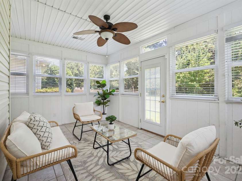 136 Samdusky Lane, Mooresville, NC 28117.  MLS# CAR4275887, YatesRealty ID 25005. Sunroom (heated & cooled) to relax & enjoy!