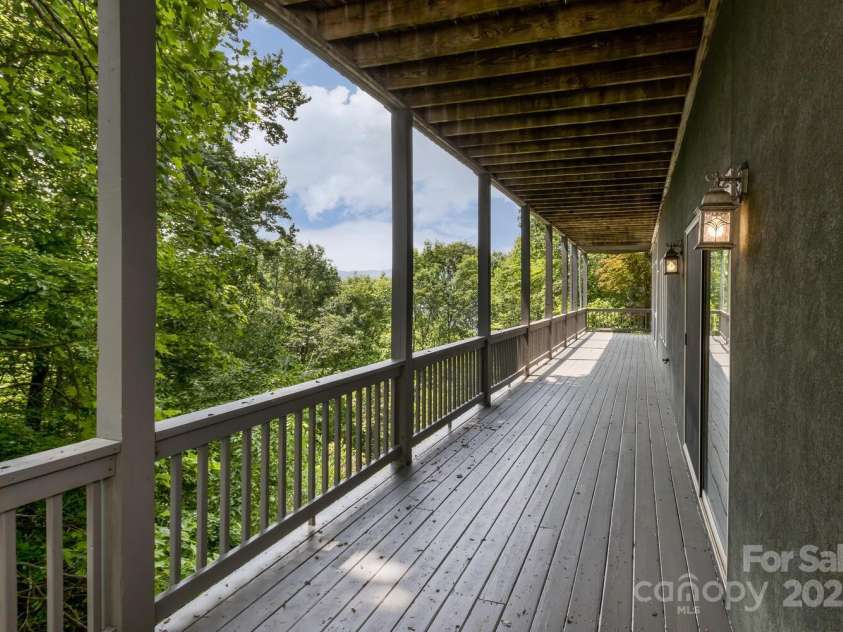 311 Mountain Crest Drive, Hendersonville, NC 28739.  MLS# CAR4268667, YatesRealty ID 25011. Lower Covered Deck