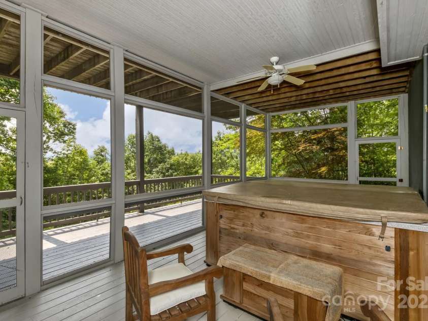 311 Mountain Crest Drive, Hendersonville, NC 28739.  MLS# CAR4268667, YatesRealty ID 25011. Lower Screened Deck