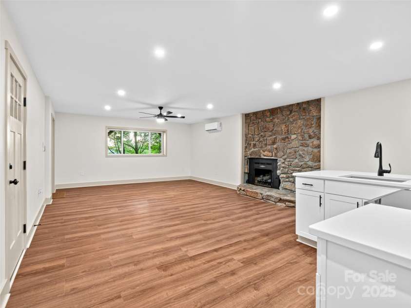 1065 Oak Ridge Lane, Mars Hill, NC 28754.  MLS# CAR4279845, YatesRealty ID 25012. Basement Living and Kitchen