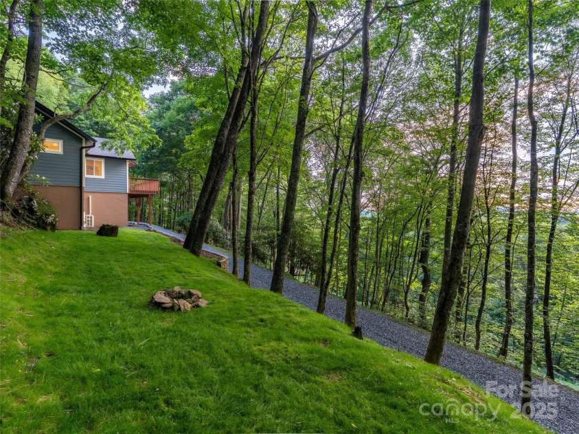 1065 Oak Ridge Lane, Mars Hill, NC 28754.  MLS# CAR4279845, YatesRealty ID 25012. Fire pit area
