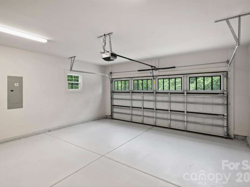 201 Coxe Avenue, Charlotte, NC 28208.  MLS# CAR4381633, YatesRealty ID 25012. Finished garage