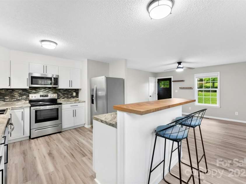 103A Tracy Street, Kings Mountain, NC 28086.  MLS# CAR4263785, YatesRealty ID 25015. Kitchen island chairs convey