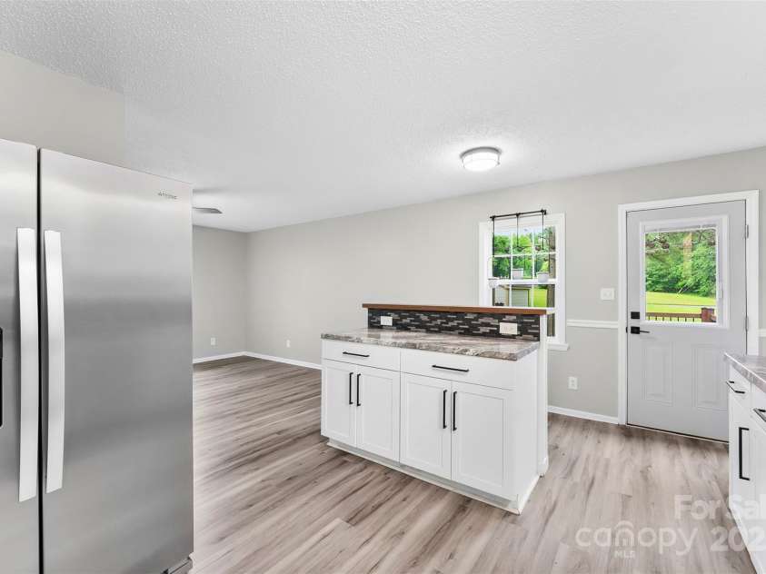 103A Tracy Street, Kings Mountain, NC 28086.  MLS# CAR4263785, YatesRealty ID 25015. Kitchen island has electrical outlet.