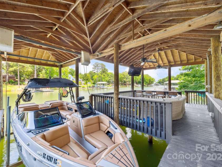 2004 Marquesas Avenue, Tega Cay, SC 29708.  MLS# CAR4267074, YatesRealty ID 25019. Boat Lift