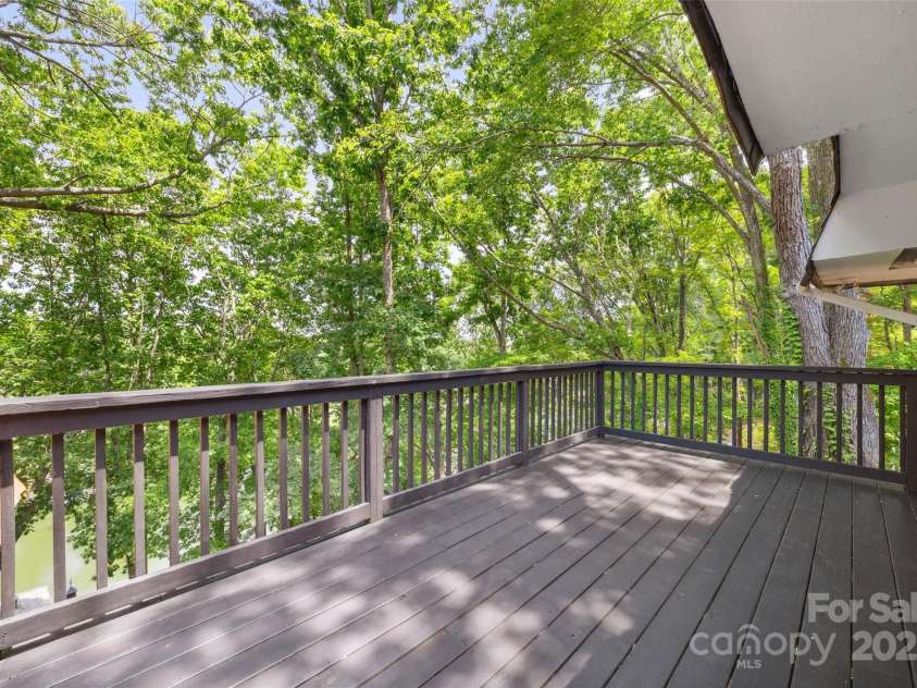 2004 Marquesas Avenue, Tega Cay, SC 29708.  MLS# CAR4267074, YatesRealty ID 25019. Deck off Primary Bedroom