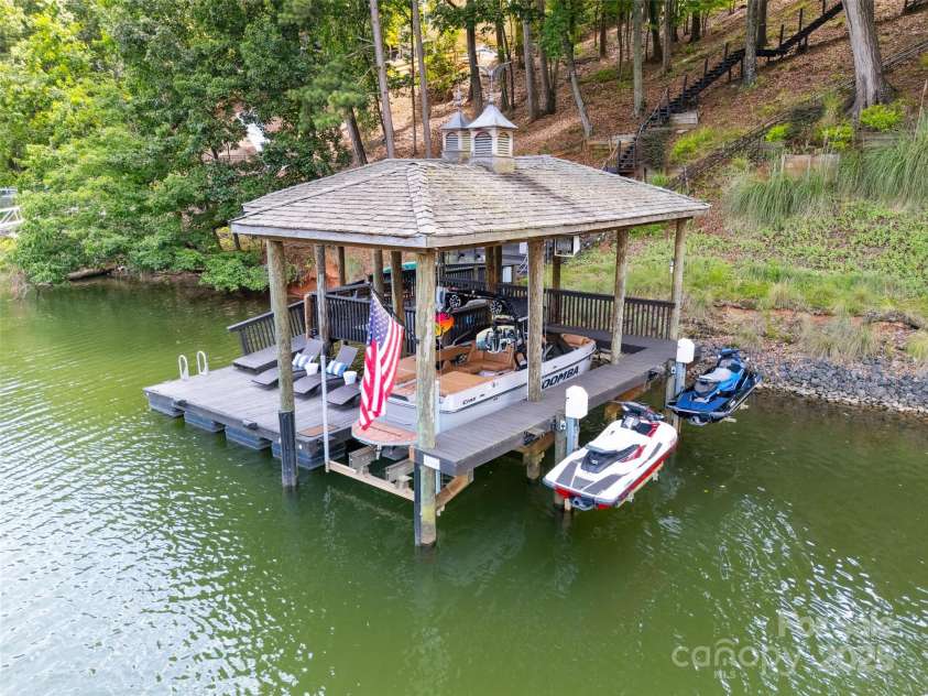 2004 Marquesas Avenue, Tega Cay, SC 29708.  MLS# CAR4267074, YatesRealty ID 25019. Dock with Boat Lift & Wave Runner Lifts
