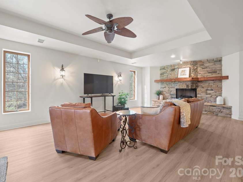 301 Agnew Road, Mooresville, NC 28117.  MLS# CAR4337466, YatesRealty ID 2502. A TV room with  custom fireplace