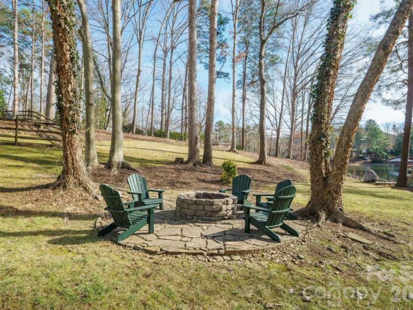 301 Agnew Road, Mooresville, NC 28117.  MLS# CAR4337466, YatesRealty ID 2502. Backyard fire pit 
