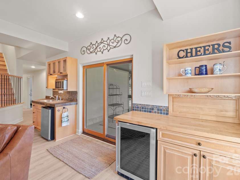 301 Agnew Road, Mooresville, NC 28117.  MLS# CAR4337466, YatesRealty ID 2502. Wait, group plans don't align....no problem, send a group to the finished basement which includes a refreshment center 