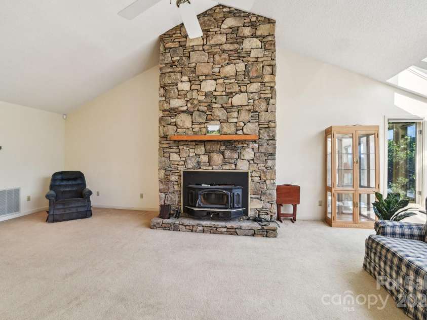 2281 Bearwallow Road, Edneyville, NC 28792.  MLS# CAR4234410, YatesRealty ID 25021. Dramatic stone fireplace