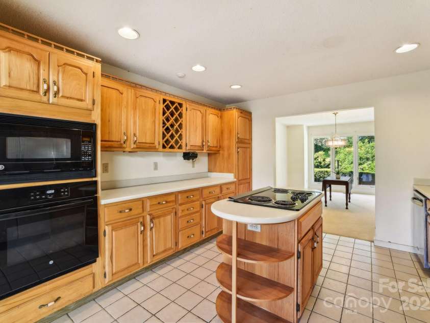 2281 Bearwallow Road, Edneyville, NC 28792.  MLS# CAR4234410, YatesRealty ID 25021. Kitchen looking towards dining room