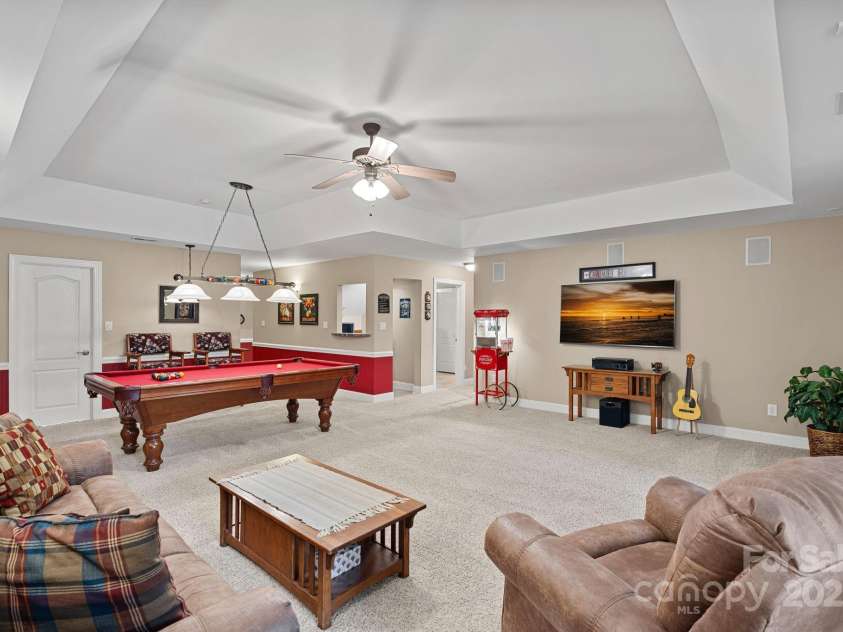 166 Pinnacle Shores Drive, Mooresville, NC 28117.  MLS# CAR4259986, YatesRealty ID 25031. Large recreation/billiard room on basement level
