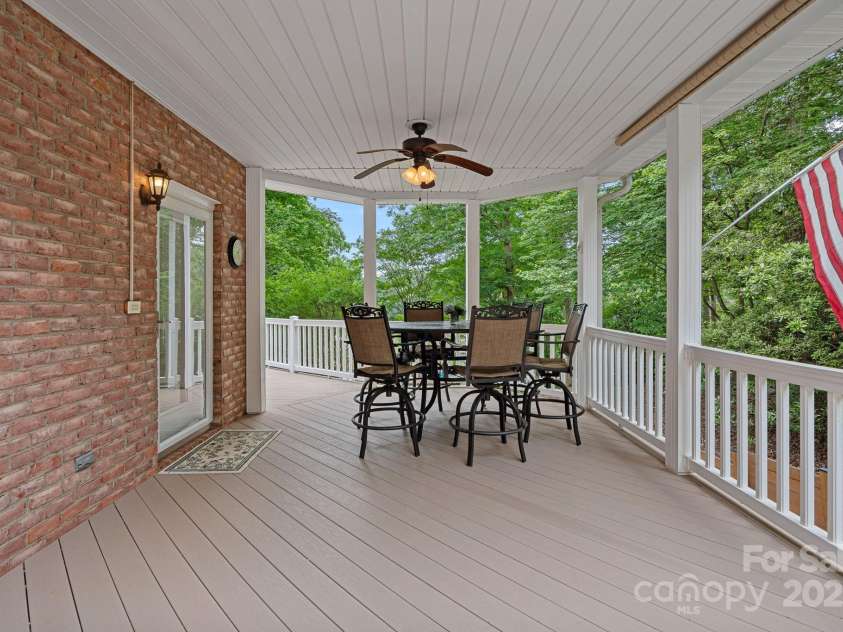 166 Pinnacle Shores Drive, Mooresville, NC 28117.  MLS# CAR4259986, YatesRealty ID 25031. Main level covered porch off of kitchen