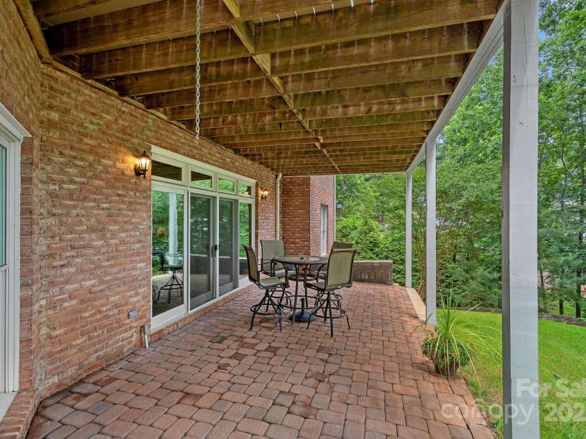 166 Pinnacle Shores Drive, Mooresville, NC 28117.  MLS# CAR4259986, YatesRealty ID 25031. Rear lower porch off basement recreation room