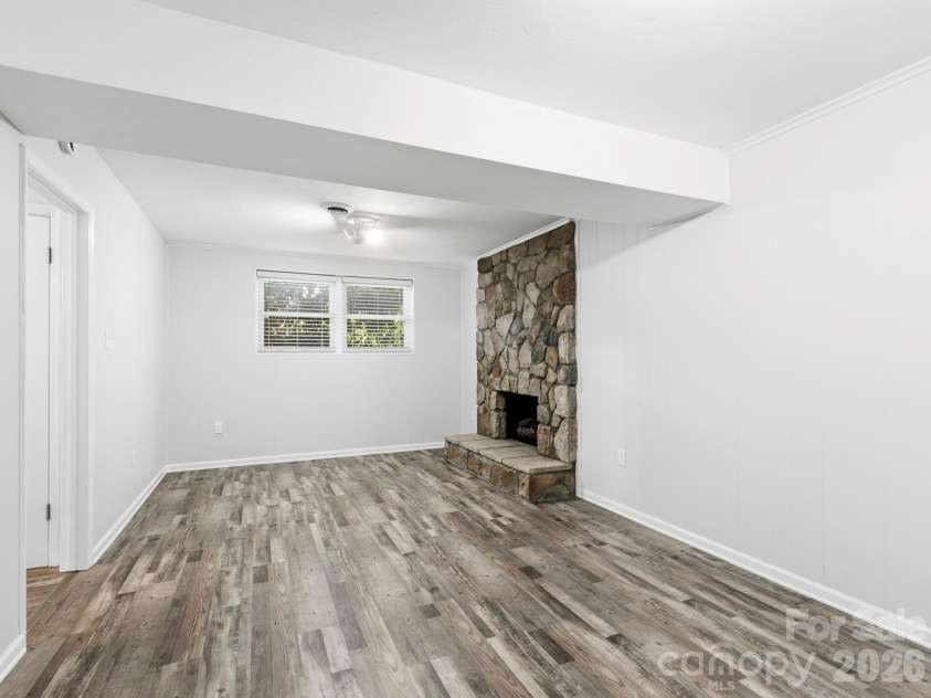 3 Fieldcrest Drive, Candler, NC 28715.  MLS# CAR4379403, YatesRealty ID 25035. Lower lever Den