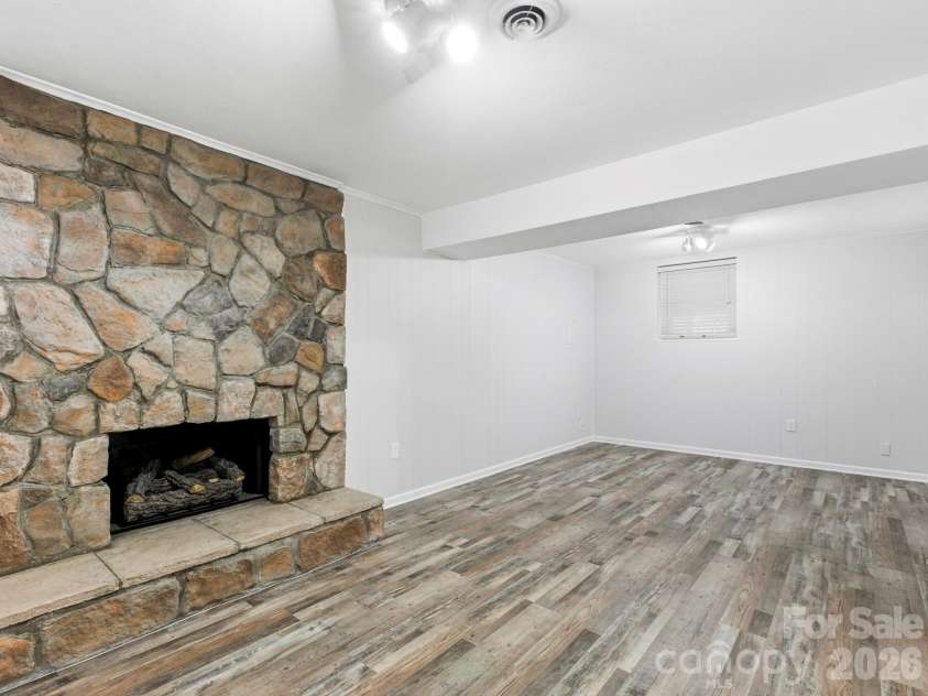 3 Fieldcrest Drive, Candler, NC 28715.  MLS# CAR4379403, YatesRealty ID 25035. Lower lever Den