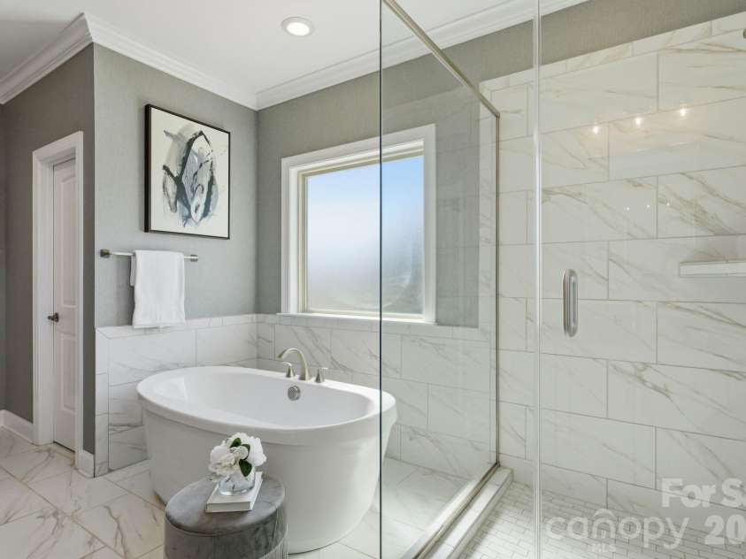 1020 Liggets Drive, Matthews, NC 28104.  MLS# CAR4369265, YatesRealty ID 25040. Spacious spa-like primary ensuite