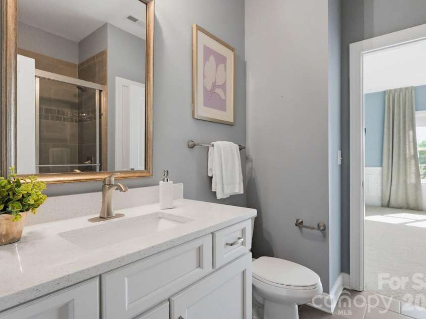 1020 Liggets Drive, Matthews, NC 28104.  MLS# CAR4369265, YatesRealty ID 25040. Upstairs bathroom