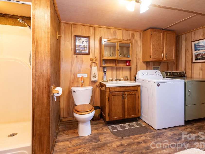 1010 and 1014 Melton Branch Road, Bakersville, NC 28705.  MLS# CAR4333369, YatesRealty ID 25045. Cabin Bathroom/Laundry