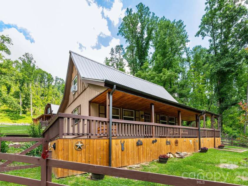 1010 and 1014 Melton Branch Road, Bakersville, NC 28705.  MLS# CAR4333369, YatesRealty ID 25045. Cabin Front