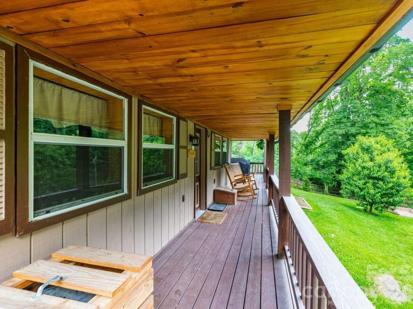 1010 and 1014 Melton Branch Road, Bakersville, NC 28705.  MLS# CAR4333369, YatesRealty ID 25045. Cabin Front Porch