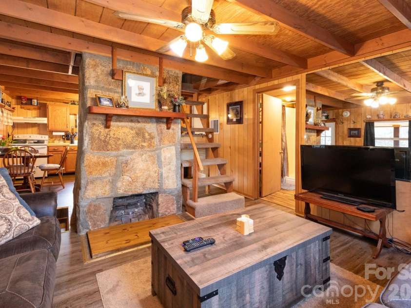 1010 and 1014 Melton Branch Road, Bakersville, NC 28705.  MLS# CAR4333369, YatesRealty ID 25045. Cabin Living Room